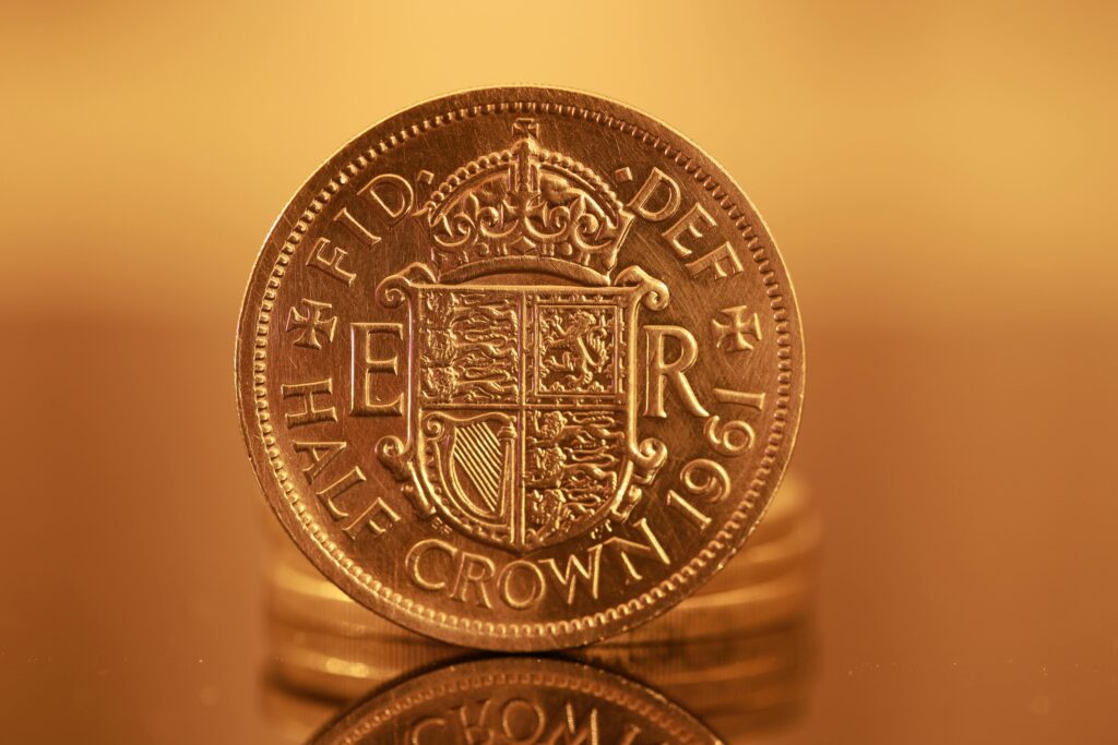 Detailed image of a 1964 British half crown coin with a royal shield design.